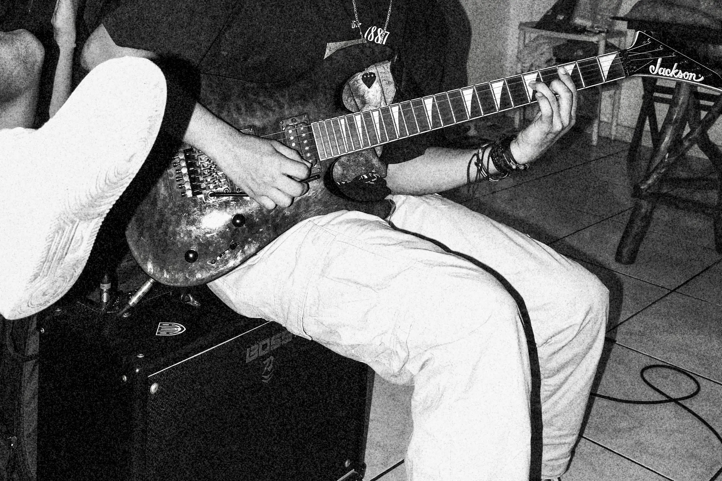 Playing electric guitar, black and white